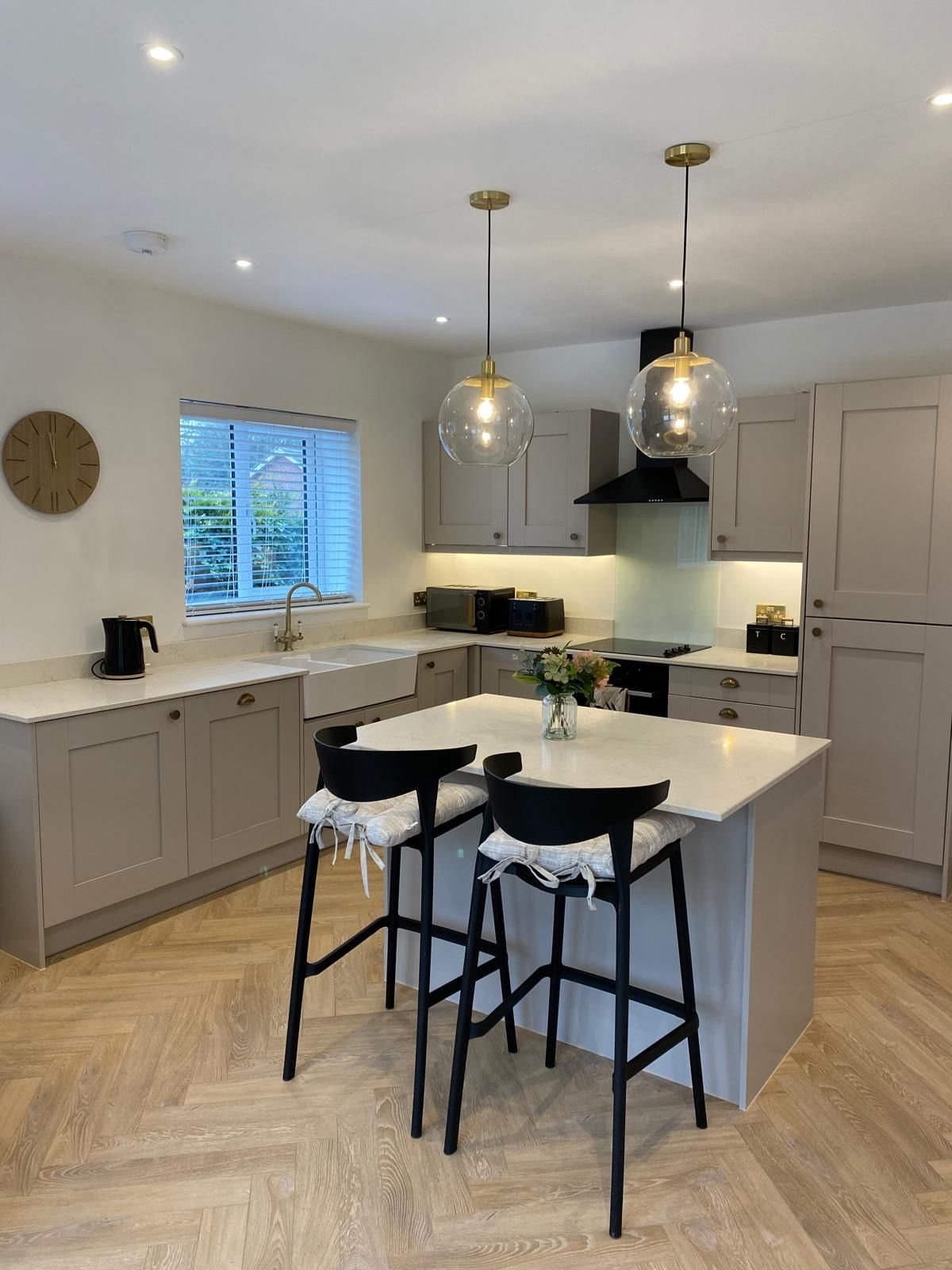 A finished shaker kitchen with an island