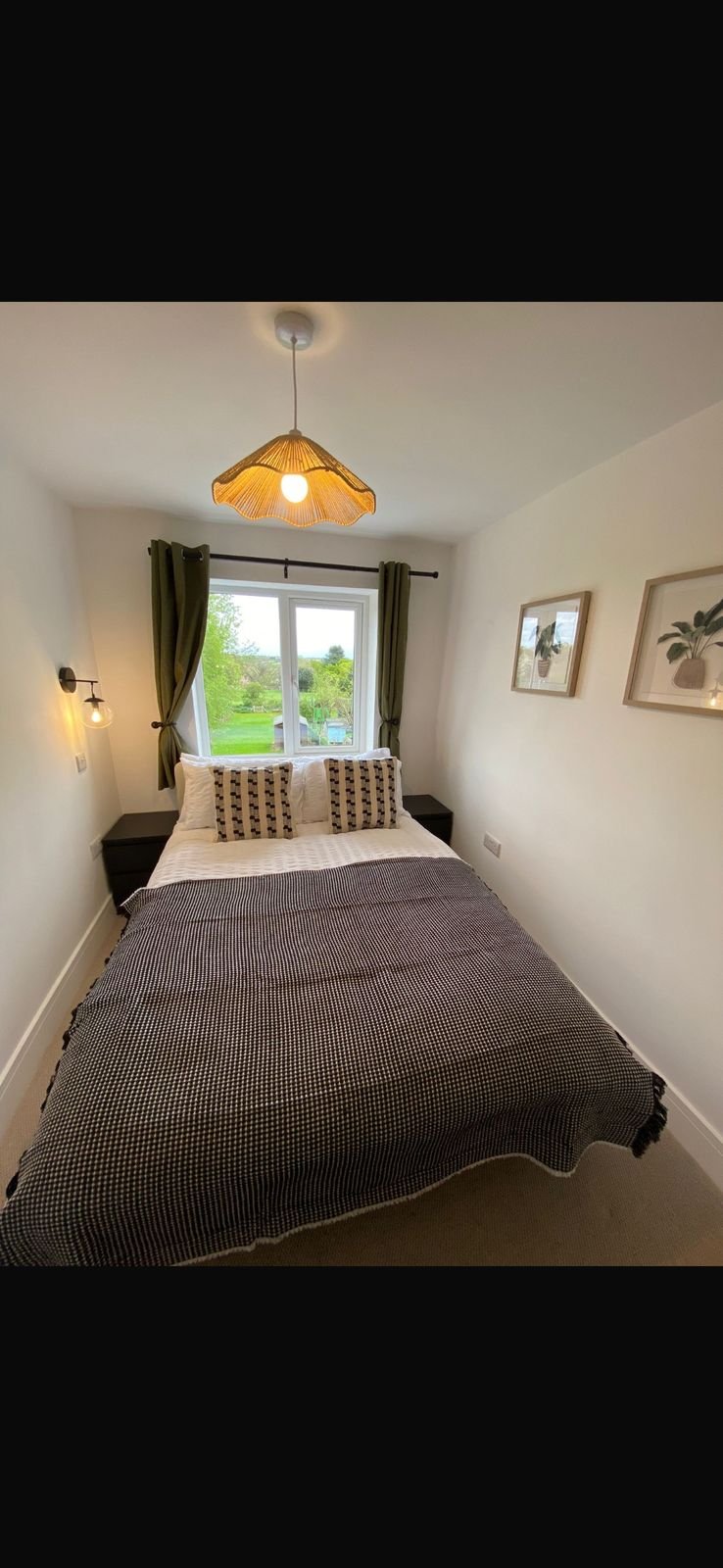 A double bedroom looking out over fields
