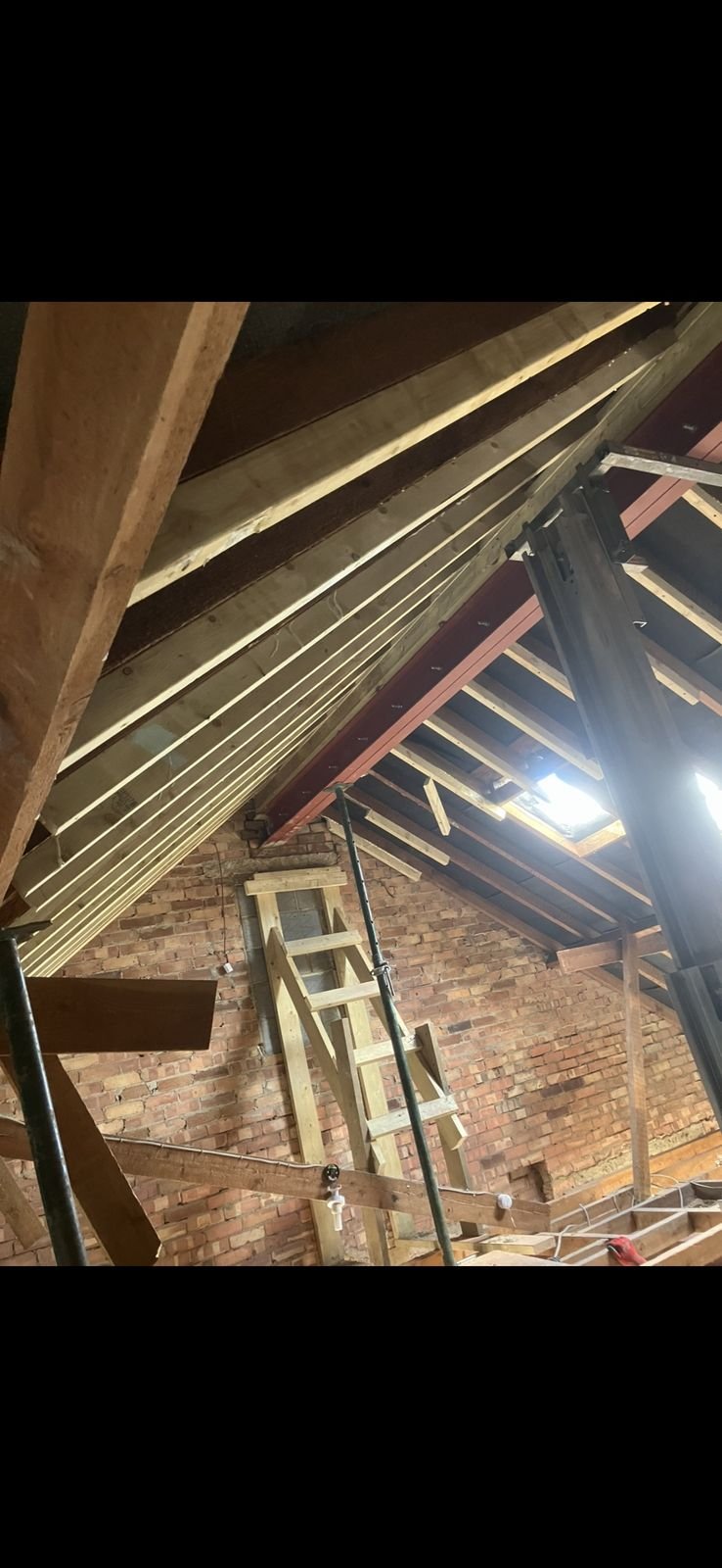 A loft with new roof timbers