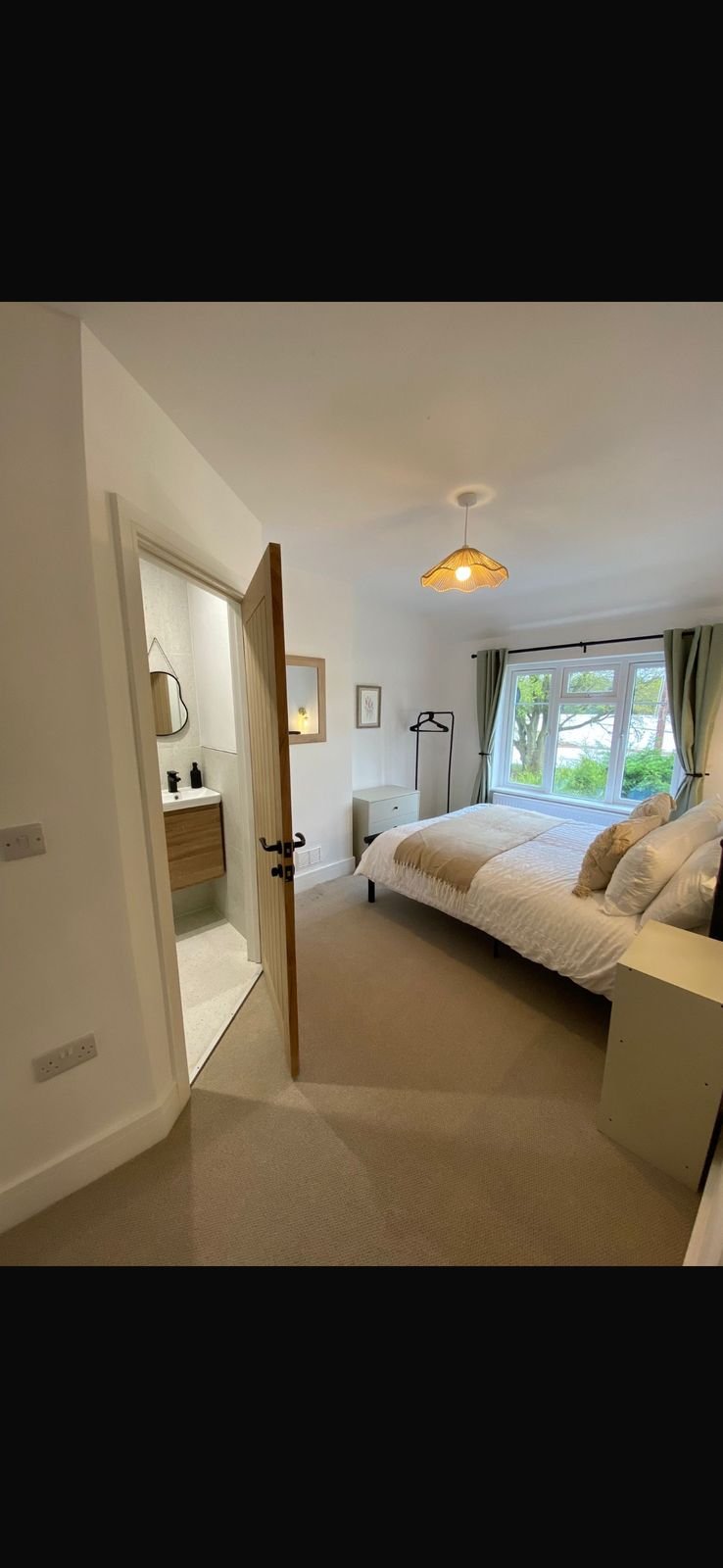 A finished bedroom with an en-suite in a rental property