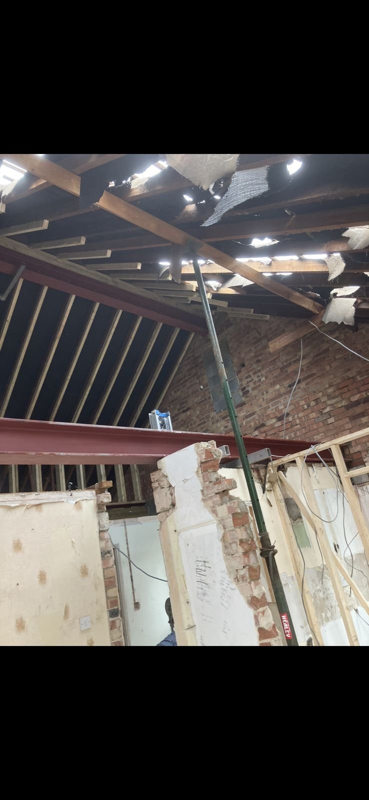 A steel beam holding up where walls have been removed